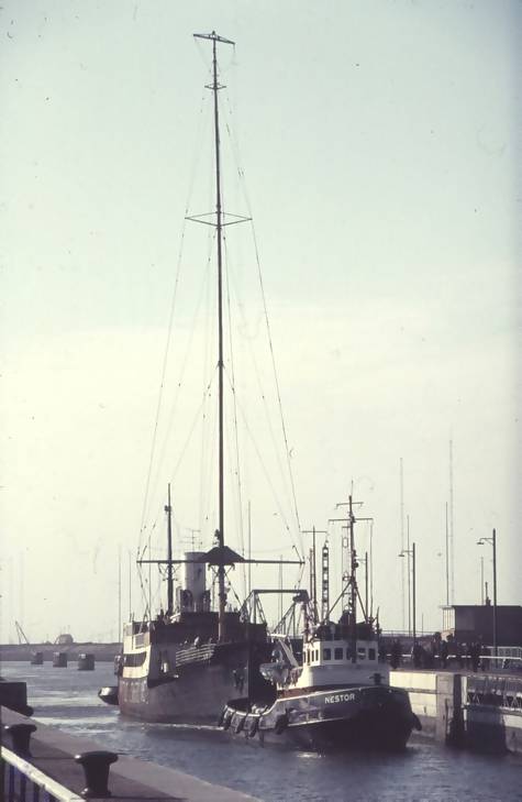 The mv Fredericia under tow