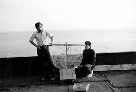 Mark West and an engineer launch a model boat