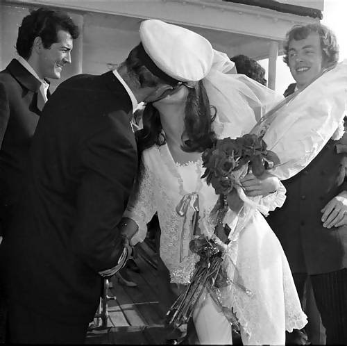 The captain kisses the bride
